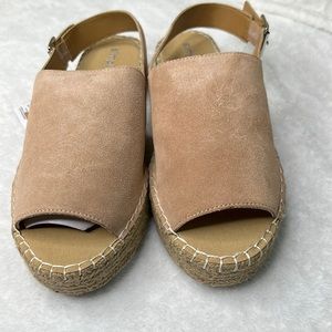 Ladies new with tag,  suede buckled sandals.  Tan color, size 10.